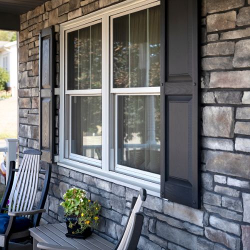 Stone facade double-hung windows